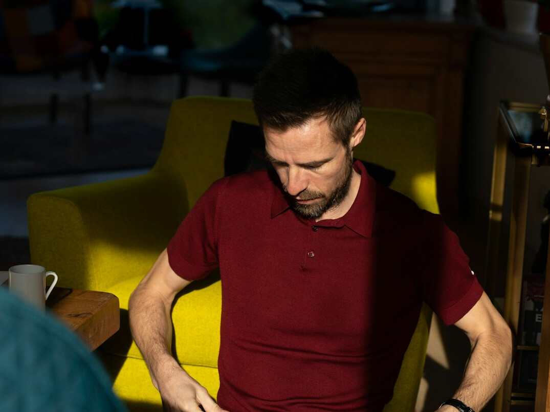 Mentor giving feedback to a company director during a coaching talk