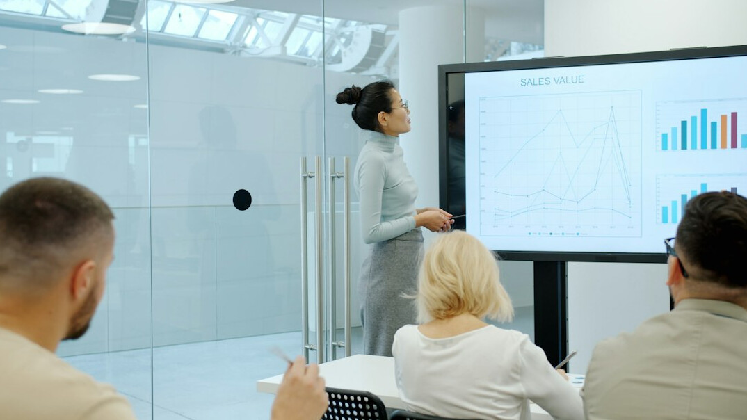 corporate leader presenting to team